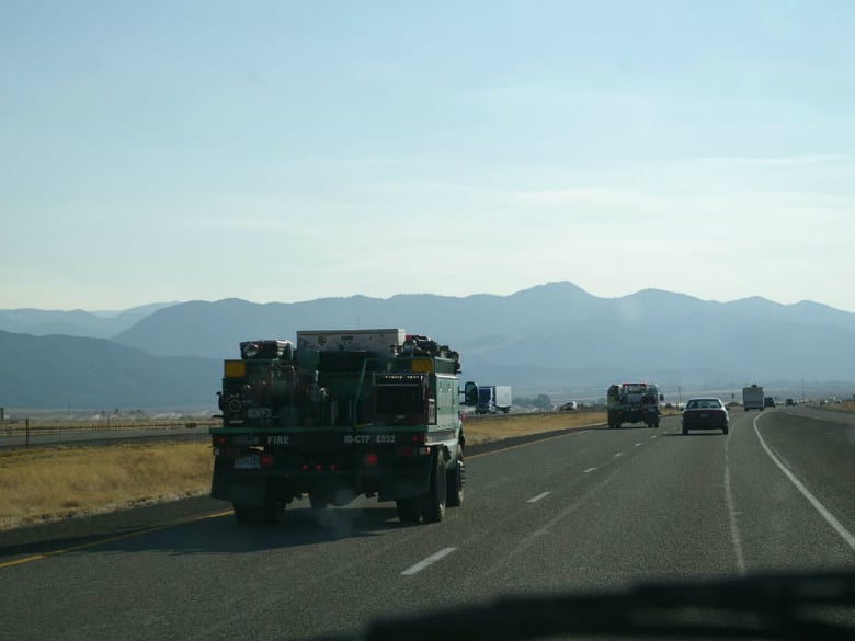 Two US Forest Services fire trucks on Interstate-15 in Utah.